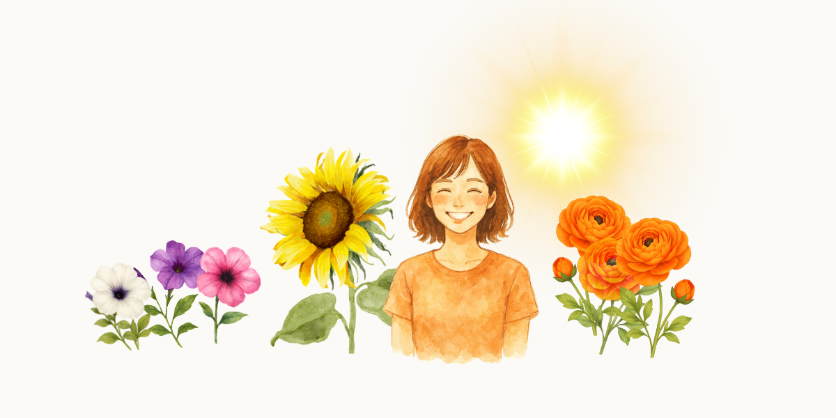 「笑」の花言葉の紹介。サフィニア、ひまわり、ラナンキュラスと横で笑顔のかわいい女性。
