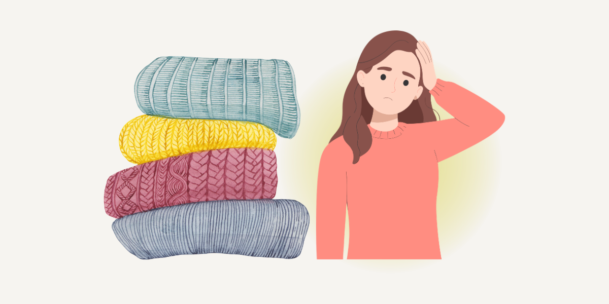 積みあがった毛布を横目に困り顔の女性。